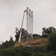 Electric company crews work on towers in Patillas, Puerto Rico, September 2018, a year after the devastating storm Hurricane Maria.